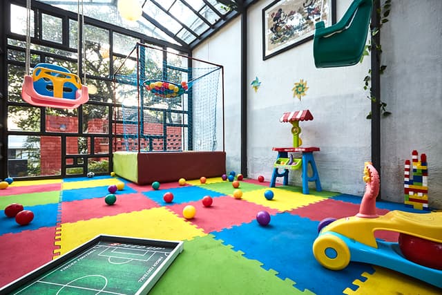 Indoor play zone and recreation center at our resort in Mahabaleshwar for family vacations.