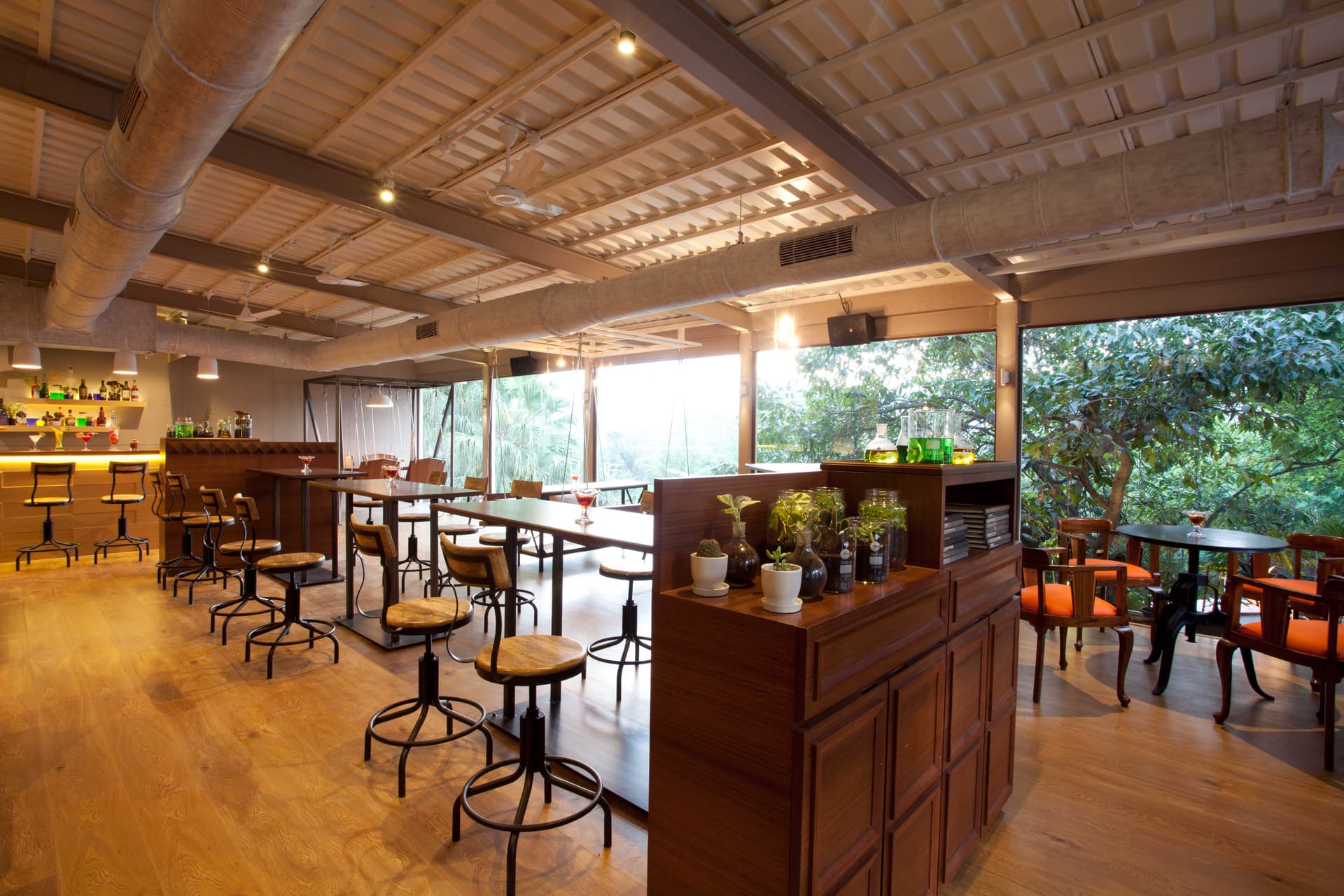 A cozy, themed lounged dining experience with a library and panoramic views — perfect to relax and unwind.