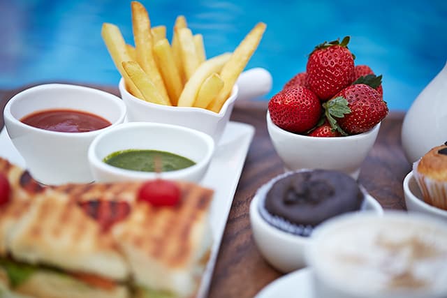 Freshly prepared appetizers at Saj Resort, a top-rated resort in Mahabaleshwar for family.