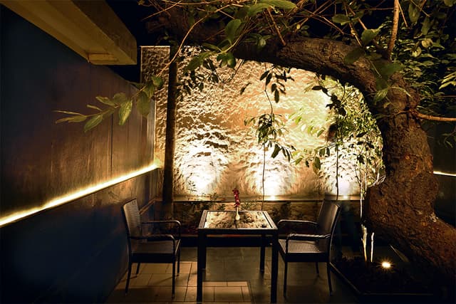 Cozy outdoor seating area at Saj Hotel Mahabaleshwar, perfect for a family holiday.